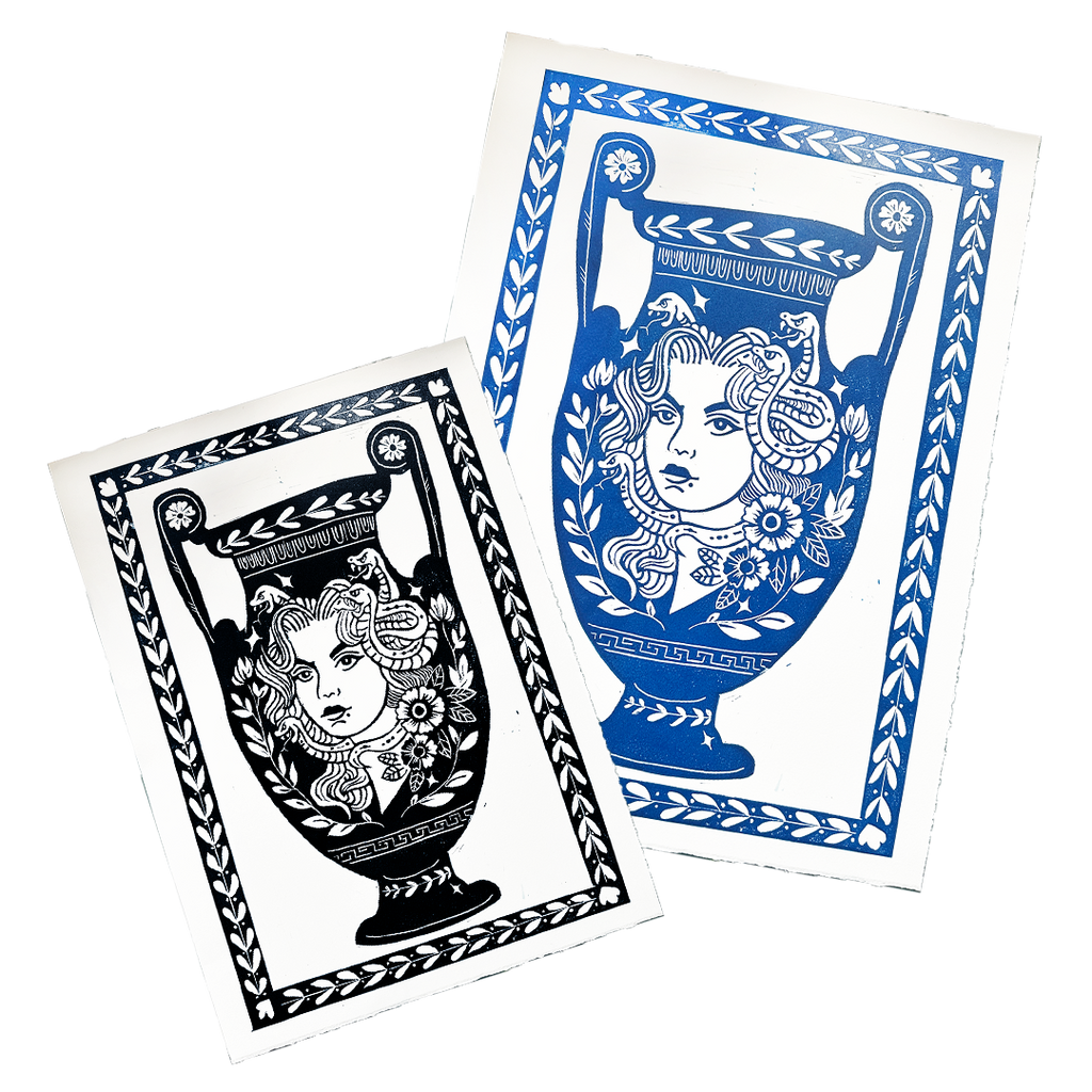 Two playing card designs with decorative borders and intricate patterns on a white background.