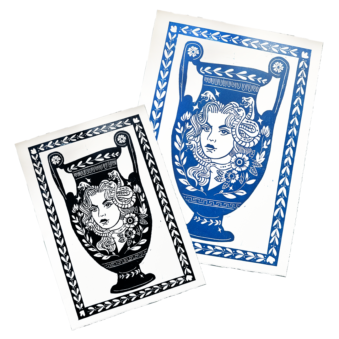 Two playing card designs with decorative borders and intricate patterns on a white background.